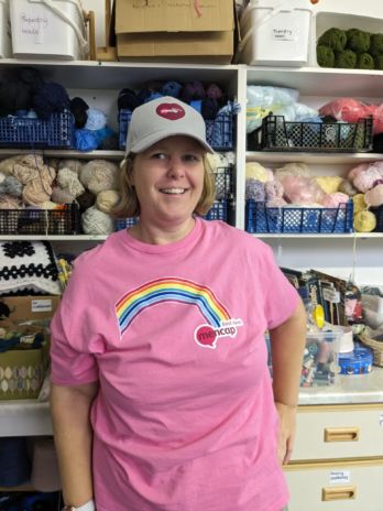 Kathy wearing a cap and t-shirt