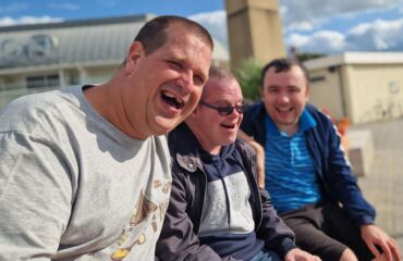 Three male members sitting on a bench in Ramsgate