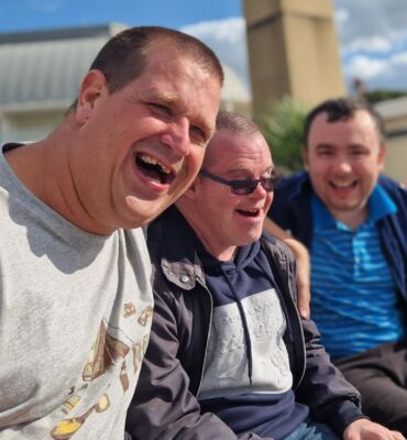 Three male members sitting on a bench in Ramsgate