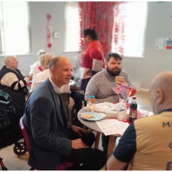 Councillor Dan Watkins at the Herne Bay Hub Valentine's event with members Joe and Paul