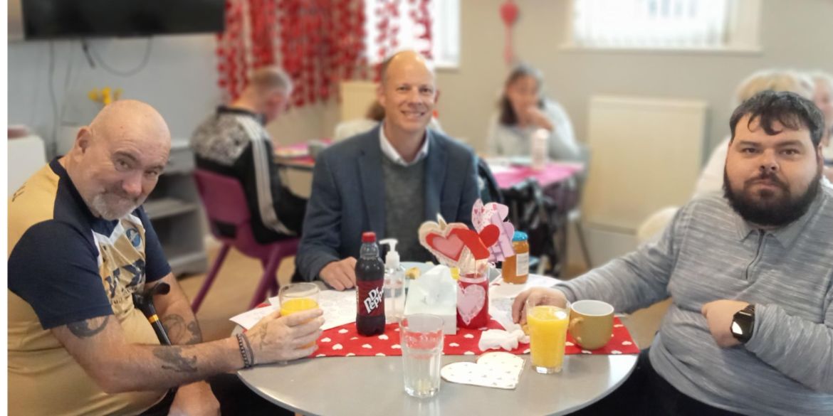 Herne Bay Hub Valentines Day Event with KCC Councillor Dan Watkins chatting with members Paul and Joe