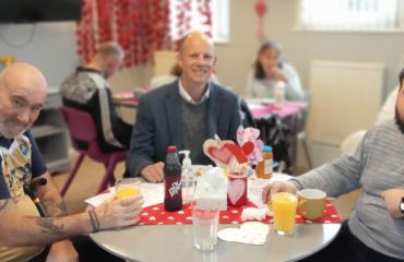 Herne Bay Hub Valentines Day Event with KCC Councillor Dan Watkins chatting with members Paul and Joe