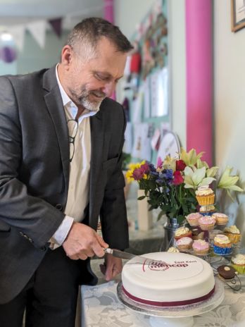 Jason cutting a cake