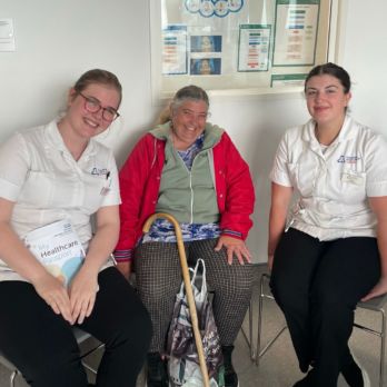 Two student nurses and a female member from GOLD smiling