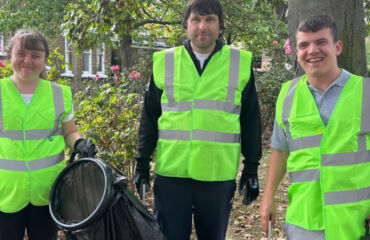 Image T Members with a learning disability at East Kent Mencap taking on litter picking and gardening