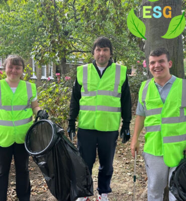 Image T Members with a learning disability at East Kent Mencap taking on litter picking and gardening